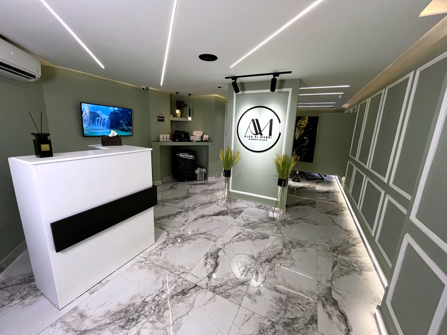 The white reception desk inside the studio