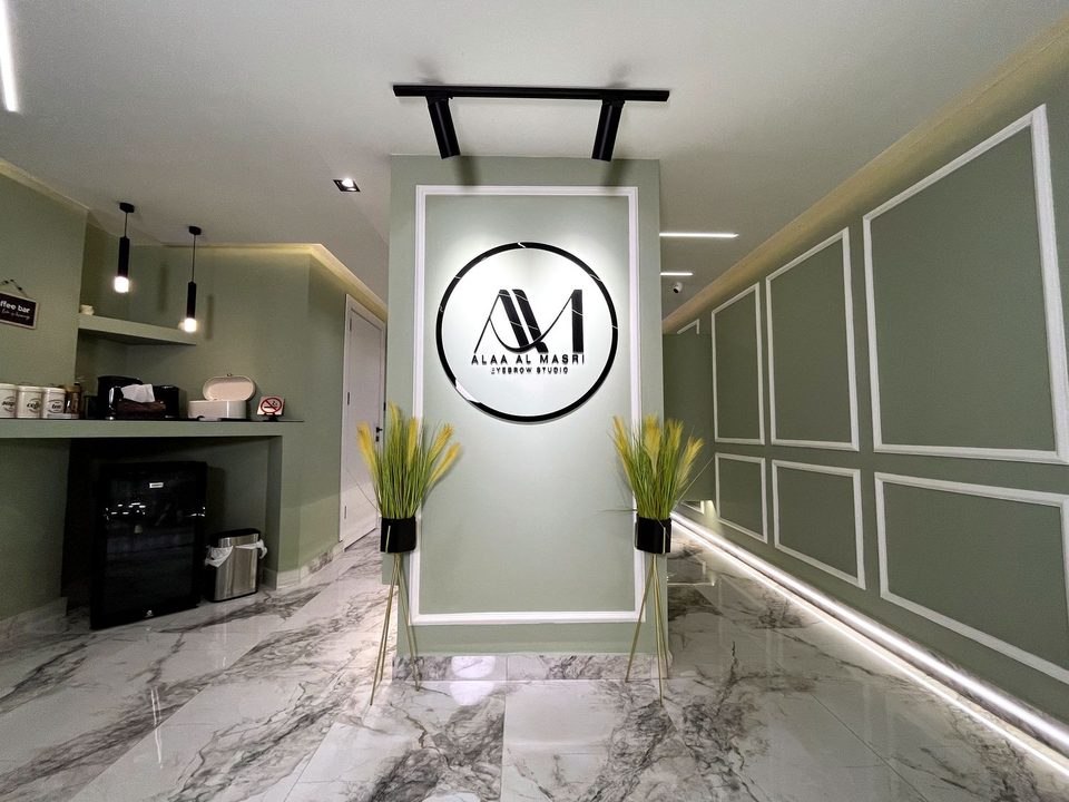The entrance to Alaa Al Masri's studio with the lit sign
